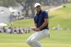 Scottie Scheffler reacts to missing a putt on a playoff hole in the semifinal round at the Dell Technologies Match Play Championship golf tournament in Austin, Texas, Sunday, March 26, 2023. Scheffler, the defending champion, lost to Sam Burns. (AP Photo/Eric Gay)