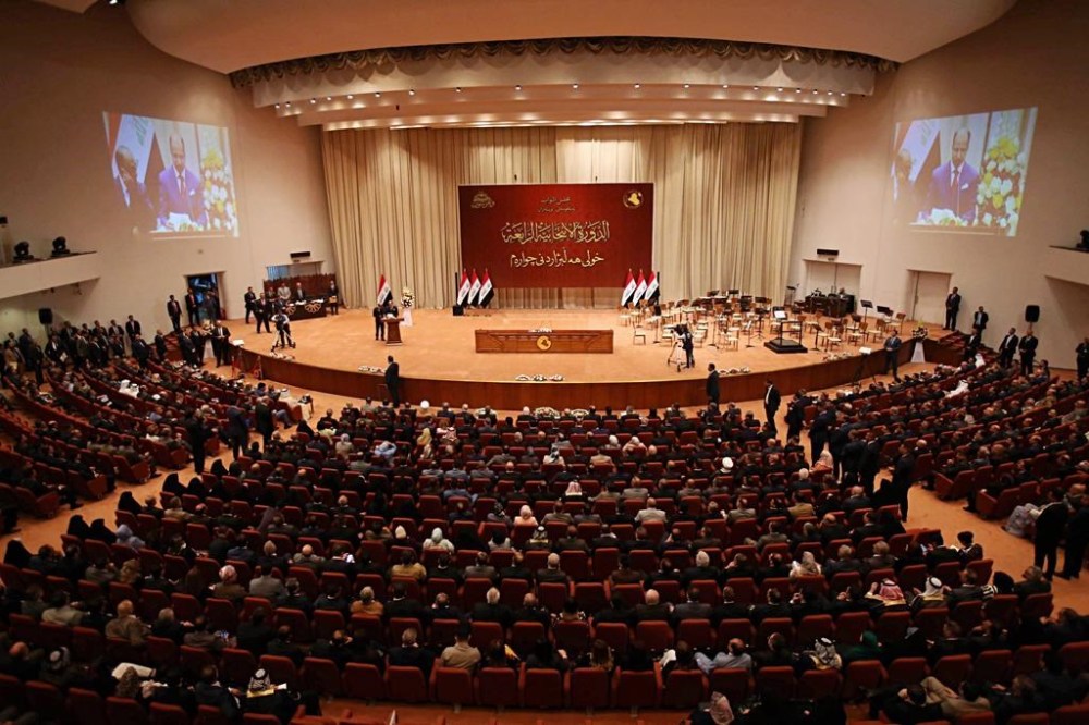 FILE - Iraqi lawmakers attend a parliament session in Baghdad, Iraq, on Sept. 3, 2018. Iraqi lawmakers passed early Monday March 27, 2023 a controversial amendment to the elections law that could hinder opportunities for smaller parties and independent candidates to win seats in future polls. (AP Photo/Karim Kadim, File)