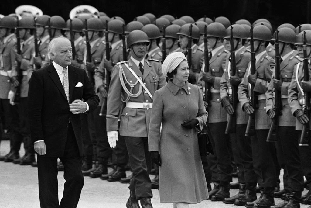 FILE - Britain's Queen Elizabeth II and West German President Walter Scheel inspect honor guards of the West German army in Bonn on May 22, 1978, when Queen Elizabeth arrived for a five-day state visit to West Germany. One would like two horses. That, in effect, was the gift requested by Queen Elizabeth II during her state visit to Germany in 1978, weekly Der Spiegel reported Monday, March 27, 2023. (AP Photo, File)