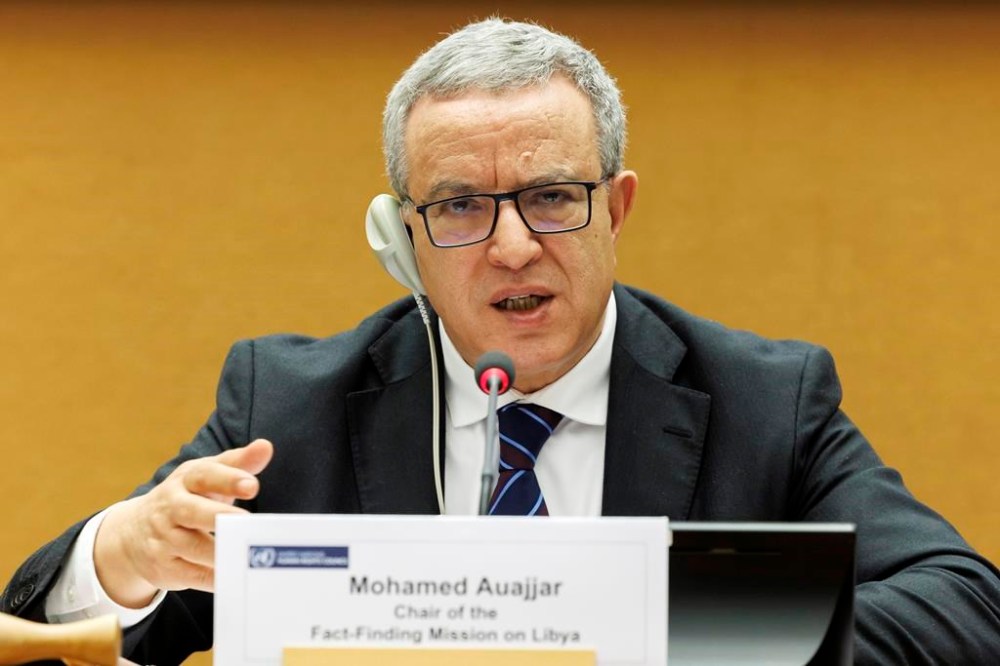 Mohamed Auajjar, center, Chairperson of the Independent Fact-Finding Mission on Libya, speaks to the media ahead of presenting the findings of the final report, at the 52nd session of the Human Rights Council during a press conference, at the European headquarters of the United Nations in Geneva, Switzerland, Monday, March 27, 2023. (Salvatore Di Nolfi/Keystone via AP)
