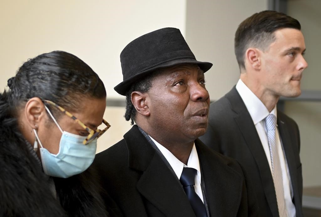FILE - Anthony Broadwater, center, gazes upward, Nov. 22, 2021, in Syracuse, N.Y., after Judge Gordon Cuffy overturned the 40-year-old rape conviction that wrongfully put him in state prison for Alice Sebold's rape. Broadwater, who spent 16 years in prison, has settled a lawsuit against New York state for $5.5 million, his lawyers said Monday, March 27, 2023. (Katrina Tulloch/The Post-Standard via AP, File)