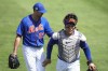 New York Mets starting pitcher David Peterson (23) walks off the field with catcher Francisco Alvarez during the fourth inning of a spring training baseball game against the Washington Nationals, Tuesday, March 14, 2023, in Port St. Lucie, Fla. (AP Photo/Lynne Sladky)
