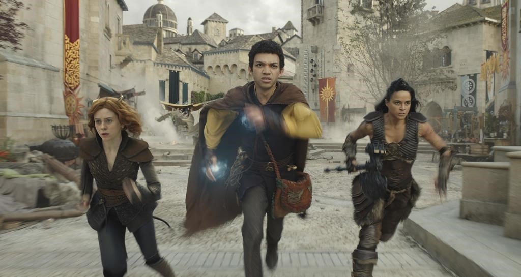 This image released by Paramount Pictures shows Sophia Lillis, from left, Justice Smith and Michelle Rodriguez in a scene from 