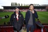 FILE - Wrexham co-chairmen Rob McElhenney, left, and Ryan Reynolds during a press conference at the Racecourse Ground, Wrexham, Wales, on Oct. 28, 2021. Soccer sensation Wrexham AFC is coming to America. The fifth-tier Welsh side, which has become a global fan favorite since Hollywood stars Reynolds and McElhenney bought it and then launched a documentary series, 