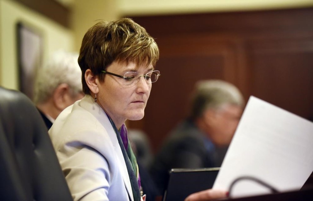 FILE - Democratic Rep. Melissa Wintrow, of Boise, looks at a paper before presenting legislation at the House Judiciary, Rules and Administration Committee meeting in the House Hearing Room in the Idaho Statehouse, Feb. 15, 2016. On Monday, March 27, 2023, the Idaho Senate voted 22-12 to pass a bill criminalizing gender-affirming healthcare for minors, one month after the state House passed similar legislation. Before the vote, Wintrow read a letter from a constituent pleading with lawmakers to reject the bill. (Greg Kreller/The Idaho Press-Tribune via AP, File)