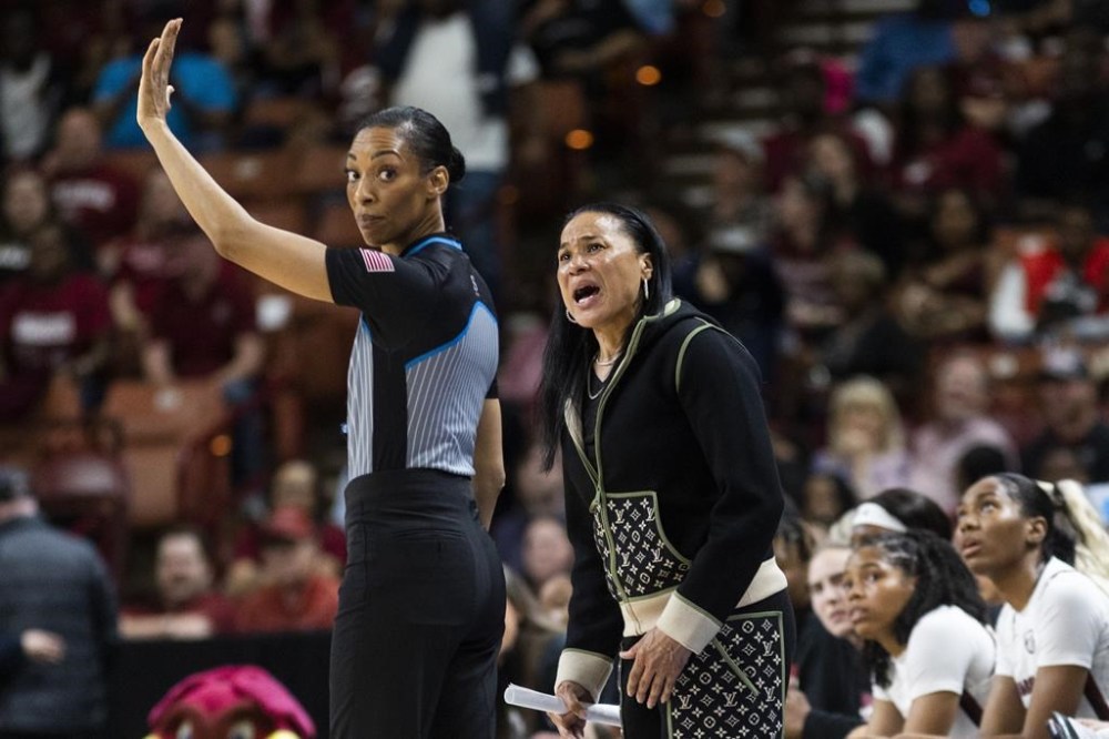 South Carolina's head coach Dawn Staley, right, argues with an official while playing against Maryland in the second half of an Elite 8 college basketball game of the NCAA Tournament in Greenville, S.C., Monday, March 27, 2023. (AP Photo/Mic Smith)