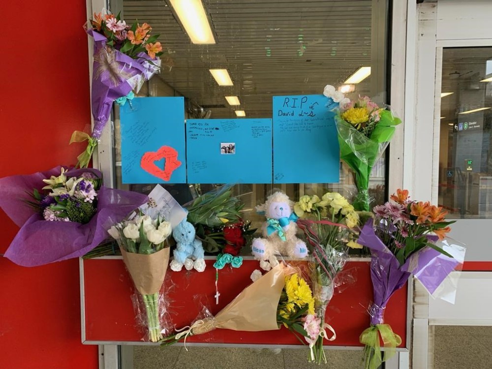 A memorial for 16-year-old Gabriel Magalhaes is shown at the Keele Street subway station in Toronto, Monday, March 27, 2023. The 22-year-old man accused of the stabbing death of a 16-year-old boy in a Toronto subway station is wanted on an outstanding warrant in Newfoundland. THE CANADIAN PRESS/Sharif Hassan