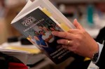 A reporter reads a copy of the Federal Budget in the lockup for the Federal budget, Tuesday, March 28, 2023 in Ottawa. THE CANADIAN PRESS/Adrian Wyld