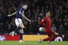 Scotland's Lyndon Dykes, left, attempts a goal as Spain's Pedro Porro tries to stop the ball during the Euro 2024 group A qualifying soccer match between Scotland and Spain at the Hampden Park stadium in Glasgow, Scotland, Tuesday, March 28, 2023. (AP Photo/Scott Heppell)