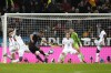 Germany's Joshua Kimmich, center left, shoots the ball during the international friendly soccer match between Germany and Belgium in Cologne, Germany, Tuesday March 28, 2023. (AP Photo/Martin Meissner)