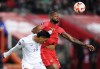 Honduras defender Denil Maldonado (15) and Canada forward Cyle Larin (17) battle for the ball during first half CONCACAF Nations League soccer action in Toronto on Tuesday, March 28, 2023. THE CANADIAN PRESS/Nathan Denette