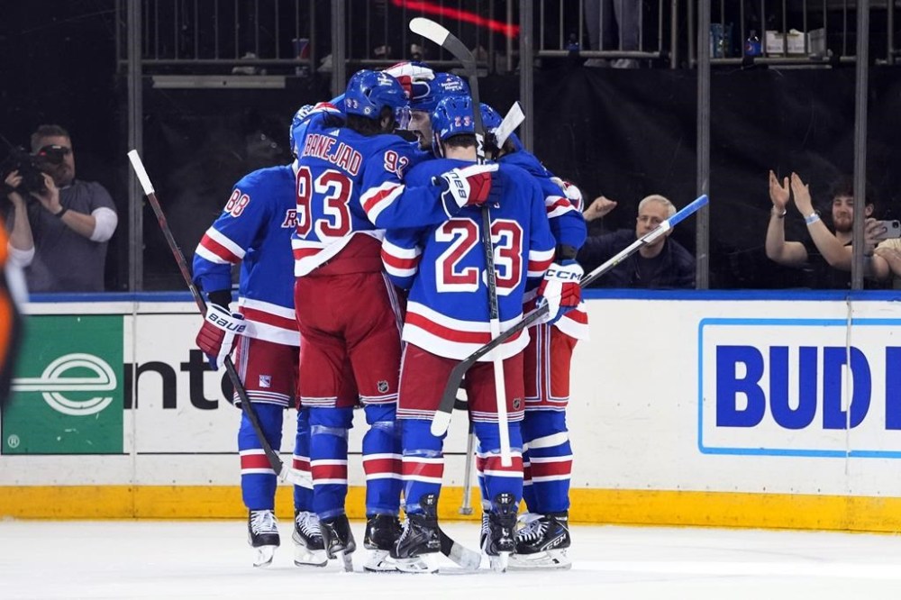 The New York Rangers celebrate a goal by New York Rangers' Artemi Panarin during the second period of an NHL hockey game against the Columbus Blue Jackets Tuesday, March 28, 2023, in New York. (AP Photo/Frank Franklin II)