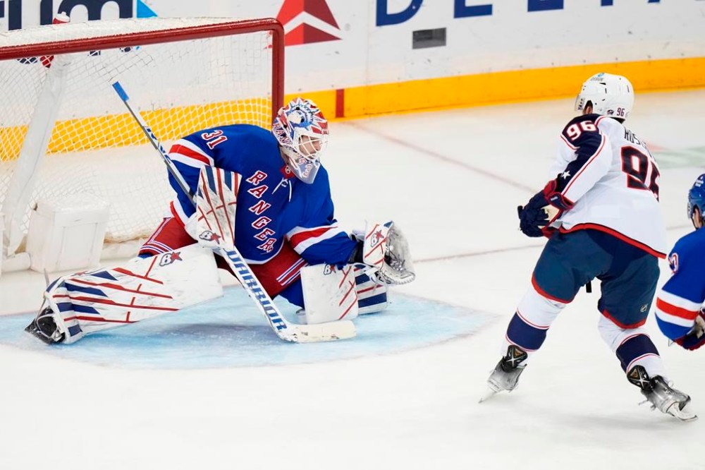 New York Rangers goaltender Igor Shesterkin (31) stops a shot on goal by Columbus Blue Jackets' Jack Roslovic (96) during the third period of an NHL hockey game Tuesday, March 28, 2023, in New York. The Rangers won 6-2. (AP Photo/Frank Franklin II)