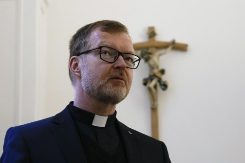 FILE - Hans Zollner, head of the new safeguarding institute at the Pontifical Gregorian University, poses for photos before an interview with the Associated Press, in Rome, Wednesday, Oct. 13, 2021. A founding member of Pope Francis’ child protection advisory board resigned Wednesday, March 29, 2023 citing inadequate financial accountability in the commission, insufficient transparency and a lack of clarity about the board’s relationship with the Holy See’s sex abuse office. (AP Photo/Alessandra Tarantino, File)
