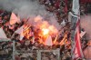 Cologne supporters light flares before the German Bundesliga soccer match between Borussia Dortmund and 1.FC Cologne in Dortmund, Germany, Saturday, March 18, 2023. (AP Photo/Martin Meissner)