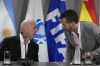 FIFA President Gianni Infantino, left, talks to CONMEBOL President Alejandro Dominguez, as they arrive for a press conference at the headquarters of the South American soccer governing body in Luque, Paraguay, Thursday, March 30, 2023. (AP Photo/Jorge Saenz)