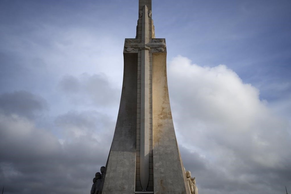 The sword of the Royal House of Avis on a stylised cross decorates the 56-meter high Monument to the Discoveries by the Tagus river in Lisbon, Thursday, March 30, 2023. The sword and cross on the monument symbolized the growth of the Portuguese empire and faith. This Thursday, the Vatican formally repudiated the