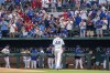 Texas Rangers fans cheer for starting pitcher Jacob deGrom (48) after he put out the Philadelphia Phillies in the first inning of an opening day baseball game, Thursday, March 30, 2023, in Arlington, Texas. (AP Photo/Jeffrey McWhorter)