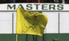 FILE - The Masters golf pin flag on the 9th green is seen with the scoreboard along the first fairway in the background at Augusta National Golf Club on Sunday, April 4, 2021, in Augusta, Ga. The Masters has no shortage of storylines at Augusta National. Tiger Woods returns after nearly two months. This will be only his third appearance against elite competition since last year's Masters. Rory McIlroy is in good form as he goes for the final leg of the career Grand Slam. And they share the stage with 18 players who most fans haven't see in more than nine months. (Curtis Compton/Atlanta Journal-Constitution via AP, File)