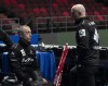 Canadian second E.J. Harnden speaks with his brother Canadian alternate Ryan Harnden (right) following a practice session at the World Curling Championship, Friday, March 31, 2023 in Ottawa. THE CANADIAN PRESS/Adrian Wyld