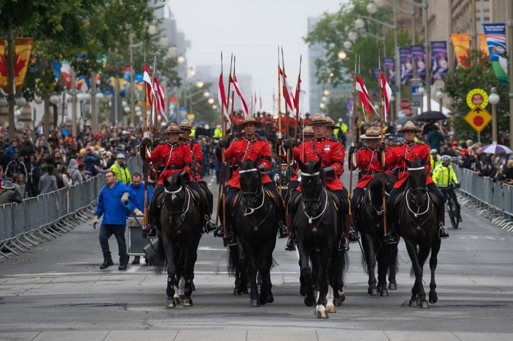 Members of the Royal Canadian Mounted Police (RCMP) are seen during a parade in honour of the late Queen Elizabeth as it makes its way down Wellington St., in Ottawa, Monday, Sept. 19, 2022. The RCMP is hoping to boost recruitment numbers in marking its upcoming 150th anniversary — even as the national force's structure and practices come under damning new scrutiny. THE CANADIAN PRESS/Spencer Colby