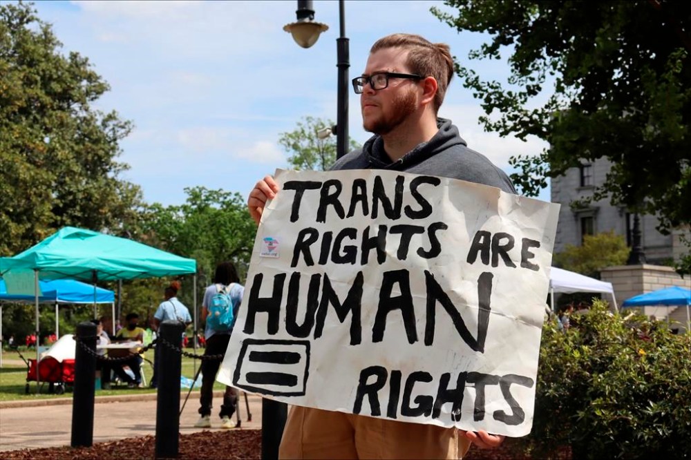Dylan Michael Turner, 27, stands outside a Transgender Day of Visibility event in Columbia, S.C., Friday, March 31, 2023. (AP Photo/James Pollard)