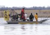 Searchers look for victims Friday, March 31, 2023. The bodies of eight migrants were pulled from the St. Lawrence River in Akwesasne, Que. THE CANADIAN PRESS/Ryan Remiorz