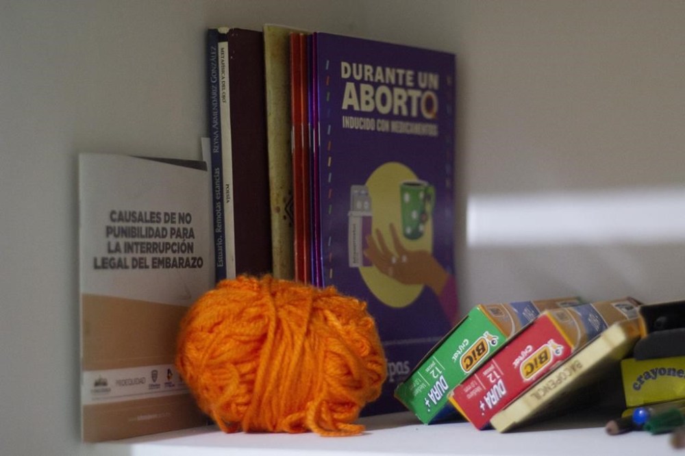 Books on abortion issues sit at the Marea Verde Chihuahua, an organization that supports reproductive rights, in Chihuahua, Mexico, Monday, March 13, 2023. To safely advise women on self-managed medical abortions, members of Marea Verde Chihuahua were trained to become “acompañantes” -- capable of serving as a guide and partner, whether in person or from long distance. (AP Photo/Adriana Esquivel)