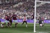 West Ham's Nayef Aguerd, left, scores his side's first goal during the English Premier League soccer match between West Ham and Southampton at the London Stadium in London, Sunday, April 2, 2023.(AP Photo/Kin Cheung)