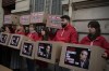 Activists demonstrate outside the Algerian embassy to France to demand the release of release of Algerian journalist Ihsane El Kadi, Thursday, March 30, 2023 in Paris. Ihsane El Kadi has for years been the target of Algerian authorities and was taken to custody on Dec. 24 2022. The verdict in his trial for 