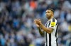 Newcastle's Callum Wilson celebrates at the end of the English Premier League soccer match between Newcastle United and Manchester United, at St. James' Park stadium in Newcastle, England, Sunday, April 2, 2023. (AP Photo/Jon Super)