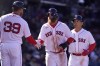 Boston Red Sox's Justin Turner, center, and Masataka Yoshida, right, are welcomed to the dugout by Christian Arroyo (39) after they both scored on a two-run home run by Adam Duvall in the fifth inning of a baseball game against the Baltimore Orioles, Sunday, April 2, 2023, in Boston. (AP Photo/Steven Senne)