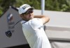 Corey Conners watches his tee shot on the first hole during the third round of the Valero Texas Open golf tournament in San Antonio, Saturday, April 1, 2023. (AP Photo/Michael Thomas)