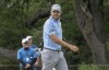 Corey Conners, of Canada, walks off of the 14th green after making a birdie on the hole during the second round of the Valero Texas Open golf tournament, Friday, March 31, 2023, in San Antonio. (AP Photo/Rodolfo Gonzalez )
