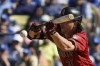 Arizona Diamondbacks' Jake McCarthy bunts for an RBI single during the ninth inning of a baseball game against the Los Angeles Dodgers Sunday, April 2, 2023, in Los Angeles. (AP Photo/Mark J. Terrill)