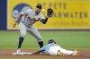 Tampa Bay Rays' Wander Franco (5) steals second base ahead of the throw to Detroit Tigers' Jonathan Schoop during the first inning of a baseball game Sunday, April 2, 2023, in St. Petersburg, Fla. (AP Photo/Chris O'Meara)