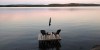 Muskoka chairs sit on a dock looking over Boshkung Lake, in Algonquin Highlands, Ont., Monday, Oct. 5, 2020. THE CANADIAN PRESS/Giordano Ciampini
