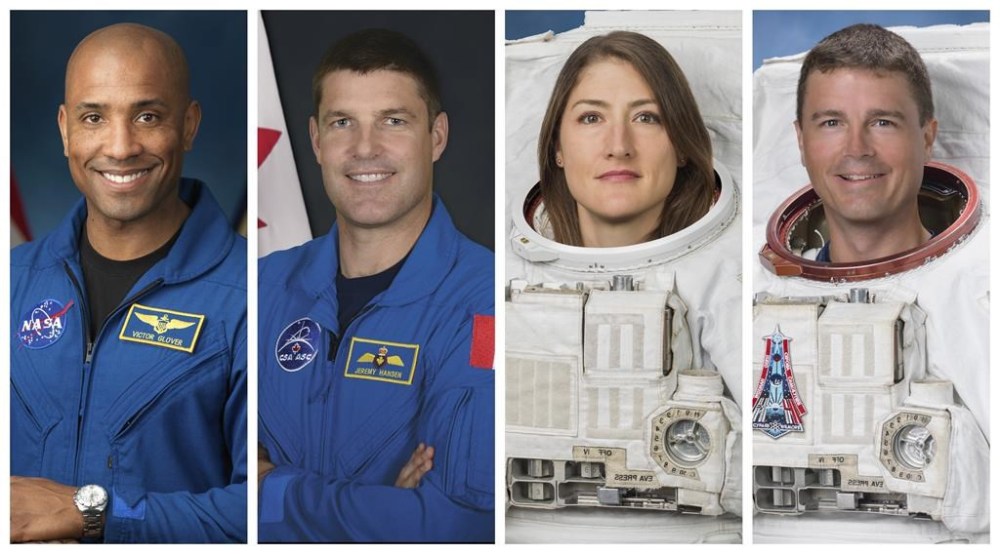 This combination of photos shows, from left, astronauts Victor Glover, Jeremy Hansen, Christina Koch, and Reid Wiseman. On Monday, April 3, 2023, NASA announced the three Americans and one Canadian as the crew who will be the first to fly the Orion capsule, launching atop a Space Launch System rocket from Kennedy Space Center no earlier than late 2024. (NASA, CSA via AP)