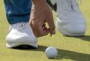 Rory McIlroy marks his ball with a “toonie,” a Canadian two-dollar coin, on the 18th green on his way to winning the Canadian Open in Toronto on Sunday, June 12, 2022. Golf Canada is launching a National Golf League for recreational players across the country. THE CANADIAN PRESS/Frank Gunn