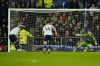 Tottenham's Harry Kane, left, scores his side's opening goal from a penalty kick during the English Premier League soccer match between Everton and Tottenham Hotspur at the Goodison Park stadium in Liverpool, England, Monday, April 3, 2023. (AP Photo/Jon Super)