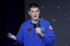 Jeremy Hansen, from Canada with the Canadian Space Agency, gives remarks after he was announced as a mission specialist during a NASA ceremony naming the four astronauts who will fly around the moon by the end of next year on the Artemis II mission, at a ceremony held in the NASA hanger at Ellington airport Monday, April 3, 2023, in Houston. This crew will not land or even go into lunar orbit. Rather, they will fly around the moon and head straight back to Earth. The 10-day mission will be a prelude to a lunar landing a year later. THE CANADIAN PRESS/AP-Michael Wyke
