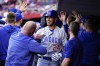 Chicago Cubs' Cody Bellinger (24) celebrates with teammates after hitting a three-run home run against Cincinnati Reds in the first inning of a baseball game in Cincinnati, Monday, April 3, 2023. (AP Photo/Jeff Dean)