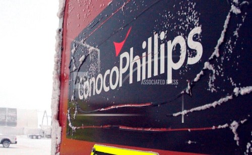 FILE - An ice-covered ConocoPhillips sign is displayed at the Colville-Delta 5, or as it's more commonly known, CD5, drilling site on Alaska's North Slope, Feb. 9, 2016. Construction can proceed related to a major oil project on Alaska’s petroleum-rich North Slope after a federal judge on Monday, April 3, 2023, rejected requests to halt work until challenges to the Biden administration’s recent approval are resolved. (AP Photo/Mark Thiessen, File)