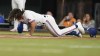 Texas Rangers' Josh Smith hits the ground after being hit by a pitch during the third inning of a baseball against the Baltimore Orioles in Arlington, Texas, Monday, April 3, 2023. (AP Photo/LM Otero)