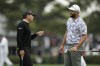 Sergio Garcia, of Spain, left speaks with Jon Rahm, of Spain, on the range during a practice for the Masters golf tournament at Augusta National Golf Club, Monday, April 3, 2023, in Augusta, Ga. (AP Photo/Charlie Riedel)