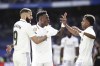Real Madrid's Karim Benzema, left, celebrates with his teammates Vinicius Junior and Real Madrid's Rodrygo, right, after scoring his side's third goal during a Spanish La Liga soccer match between Real Madrid and Valladolid at the Santiago Bernabeu stadium in Madrid, Spain, Sunday, April 2, 2023. (AP Photo/Pablo Garcia)