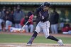 Cleveland Guardians' Andres Gimenez hits an RBI-double against the Oakland Athletics during the first inning of a baseball game in Oakland, Calif., Monday, April 3, 2023. (AP Photo/Jeff Chiu)