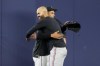 Miami Marlins pitcher Jesus Luzardo, left, and Minnesota Twins pitcher Pablo Lopez embrace before a baseball game, Tuesday, April 4, 2023, in Miami. The two pitchers are scheduled to start in Wednesday's game. Lopez formerly played for the Marlins. (AP Photo/Lynne Sladky)