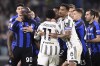 Inter Milan's Romelu Lukaku (90) and Juventus' Juan Cuadrado argue following the Italian cup semi final first leg soccer match between Juventus and Inter Milan, at the Allianz Stadium, in Turin, Italy, Tuesday, April 4, 2023. (Fabio Ferrari/LaPresse via AP)