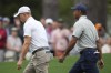 Justin Thomas and Tiger Woods walk up the sixth fairway during a practice for the Masters golf tournament at Augusta National Golf Club, Tuesday, April 4, 2023, in Augusta, Ga. (AP Photo/Jae C. Hong)